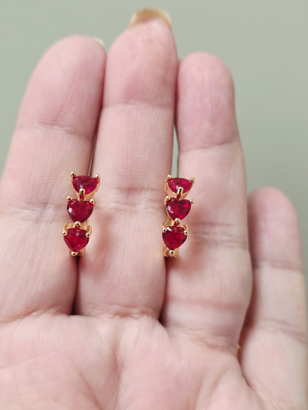 Gold Earrings with Triple Red Heart Stones